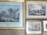 many pictures hanging on the wall of a room