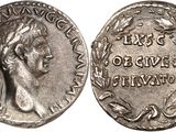 a silver coin with an image of a woman on it