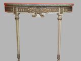 a small table with a marble top on a gray background