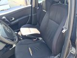 the interior of a car with the door open and the seat up