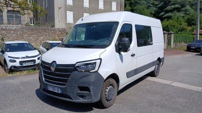 a white van that is parked on the side of the road
