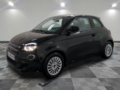 a picture of a black smart car parked in a garage