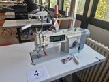 a sewing machine sitting on a table in a room