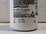 the back of a bottle of liquid sitting on top of a counter