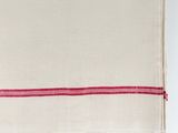 a close up of a white towel with red stripes on it