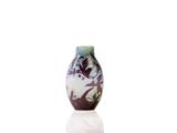 a vase that is sitting on a table with a white background