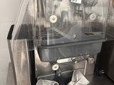 a machine that is sitting on a counter in a kitchen
