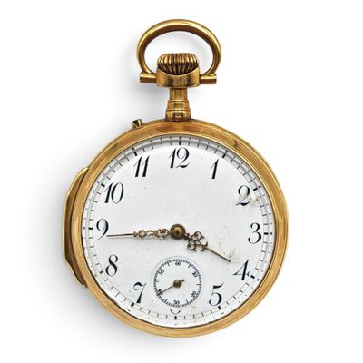 a close up of a gold pocket watch with roman numerals