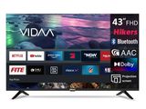 une Smart TV noire posée sur un meuble blanc