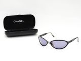 Lunettes de soleil Chanel « œil de chat » à monture noire et verres violets