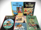 several children ' s books sitting on top of each other in front of a white background