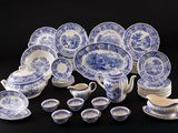 an assortment of blue and white china dishes and cups and saucers