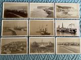 several old black and white photos of ships on a bed