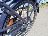 a close up of a bicycle parked on the side of the road
