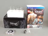 a box with a game and a glass on it