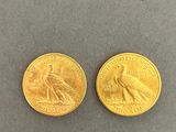 two gold coins, one with a bird on it and the other with a bird on it