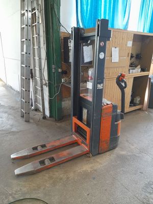 a forklift that is sitting in a garage