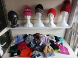 many hats and hats on display on a shelf