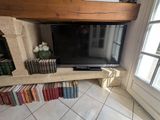 a television that is sitting on a shelf in a room