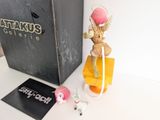 a small toy that is sitting next to a box