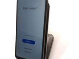 a phone that is sitting on top of a stand