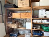 a room with a lot of boxes and boxes on the shelves