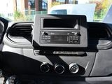 a dashboard of a car with a radio and a steering wheel