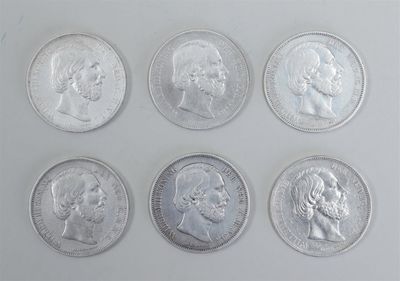 six different types of silver coins are shown on a white surface