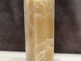 a picture of a candle that is sitting on a table