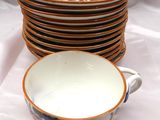 a stack of cups and saucers sitting on a table