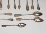 a lot of spoons and spoon spoons on the table