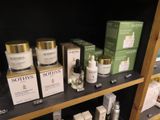 a shelf of skin care products on display in a store