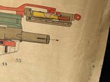 a drawing of a machine gun on a piece of paper
