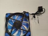 a small fan that is attached to a white wall