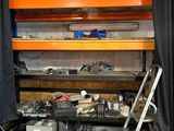 a room with a lot of clutter and tools on the shelves