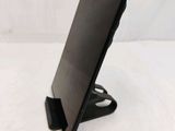 a tablet that is sitting on a stand on the table