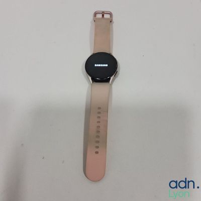 a close up of a smart watch sitting on a white surface