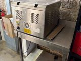 a machine that is sitting on a table in a garage