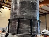 an image of a large metal tank in a warehouse