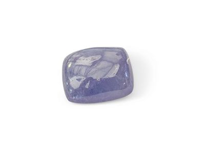 a close up of a purple stone on a white surface