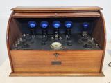 a wooden box with a bunch of blue lights inside of it