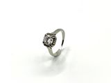 an image of a diamond ring on a white surface