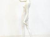 statue of a woman holding a flower in her right hand