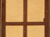 an old wooden frame with four squares on it
