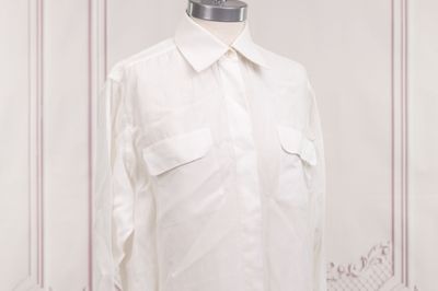 shirt on a mannequin stand in a white room