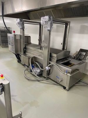 an image of a commercial kitchen with a conveyor belt