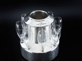 a silver ice bucket with wine glasses in it