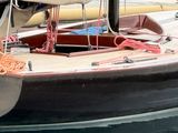 a small boat that is tied up to the dock