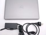 a laptop and a charger sitting on a table