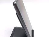a cell phone that is sitting on top of a stand